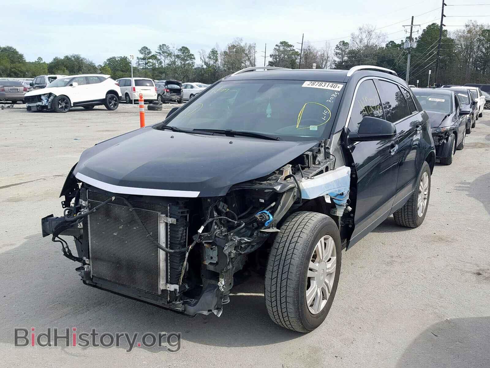 2014 CADILLAC SRX - VIN: 3GYFNBE3XES628085 - Фото 2