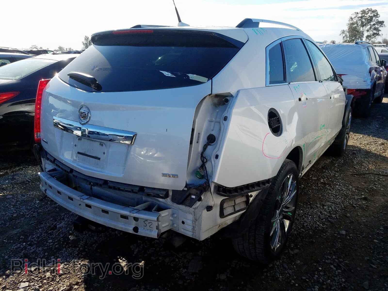 2013 CADILLAC SRX - VIN: 3GYFNCE31DS557931 - Фото 4