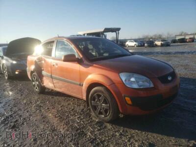 2009 Kia RIO RIO Base, orange — VIN KNADE223196515263, Copart