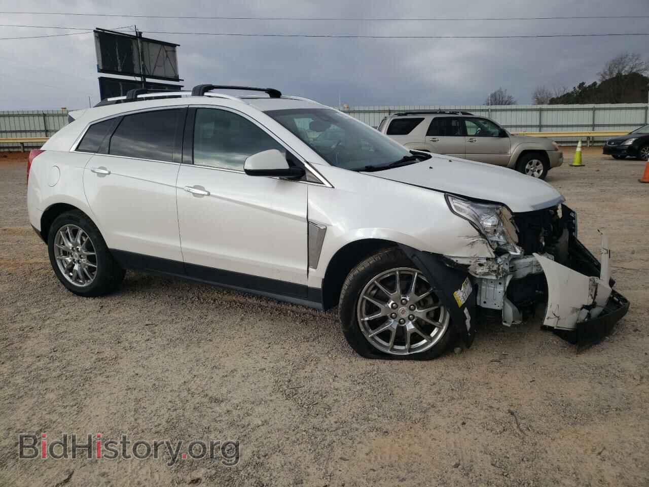 2014 CADILLAC SRX - VIN: 3GYFNCE39ES628066 - Фото 4