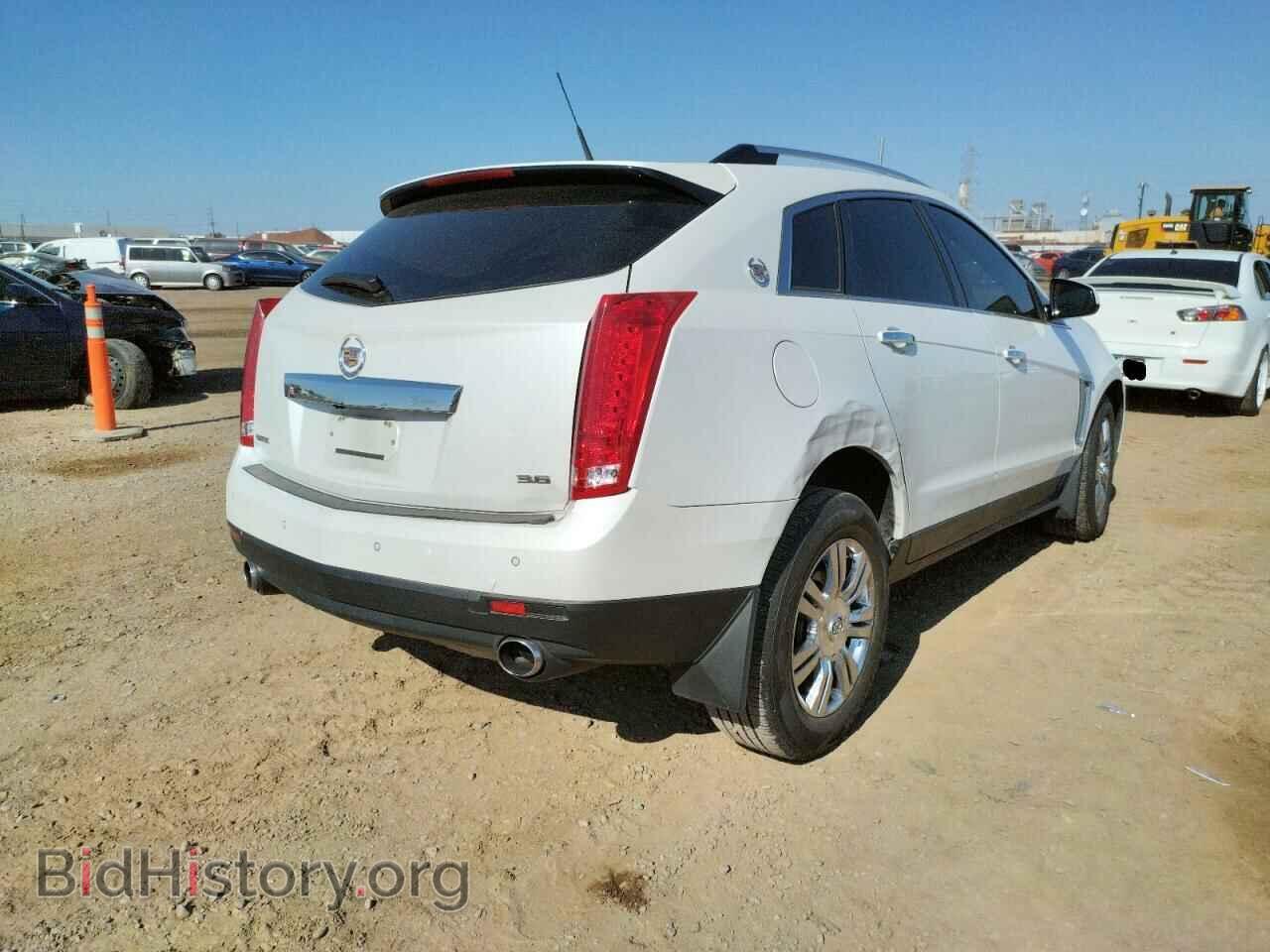 2014 CADILLAC SRX - VIN: 3GYFNBE30ES590348 - Фото 4