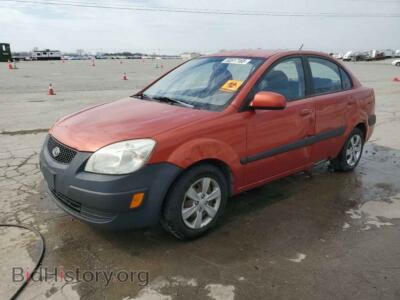 2009 Kia RIO Base, orange — VIN KNADE223096500737, Copart