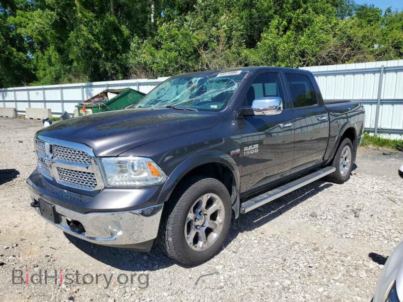 2015 RAM 1500 Laramie (VIN 1C6RR7NT7FS712938) — photo 1 of 12, Copart, damage: top/roof