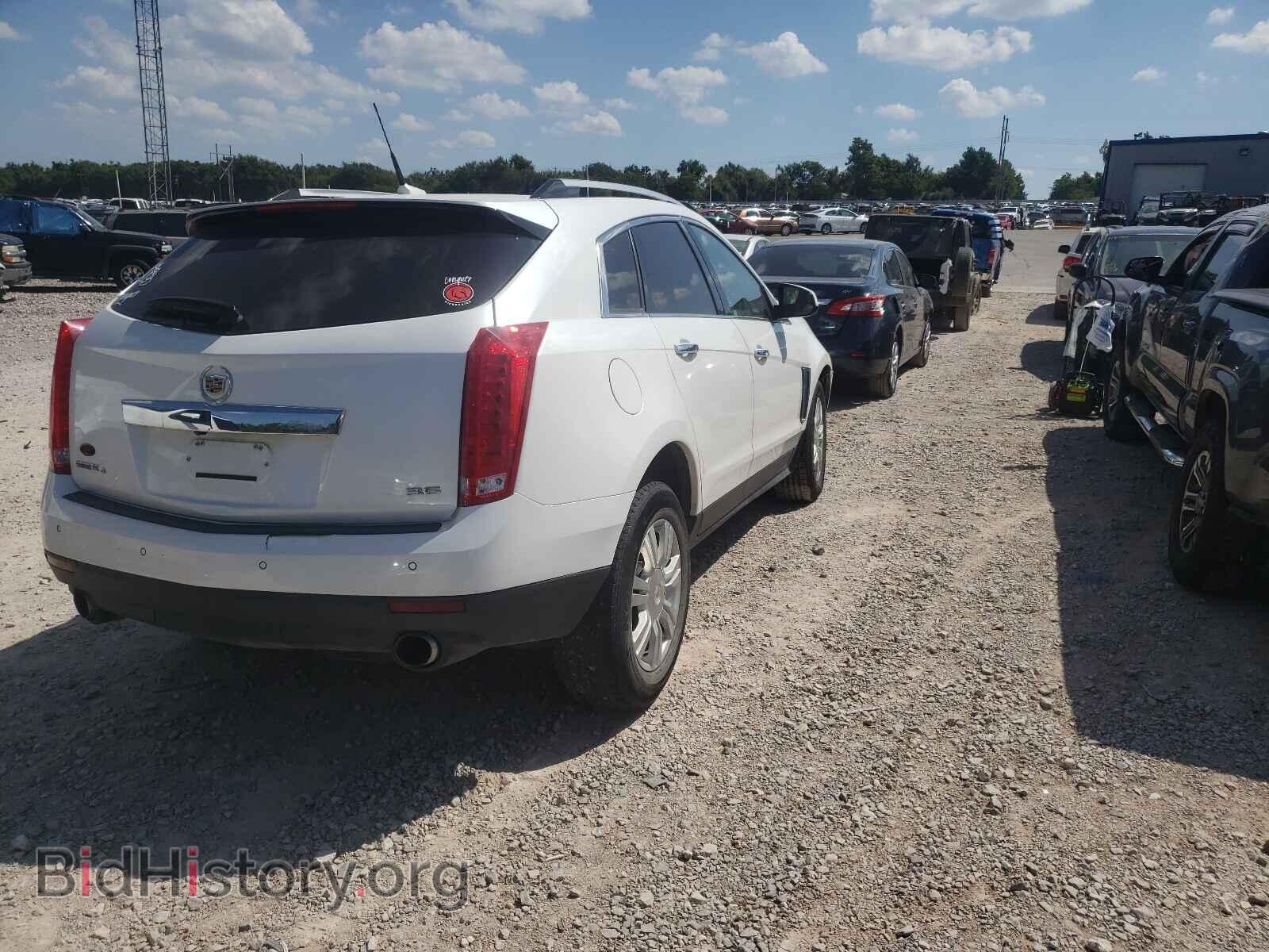 2014 CADILLAC SRX - VIN: 3GYFNEE30ES589556 - Фото 4