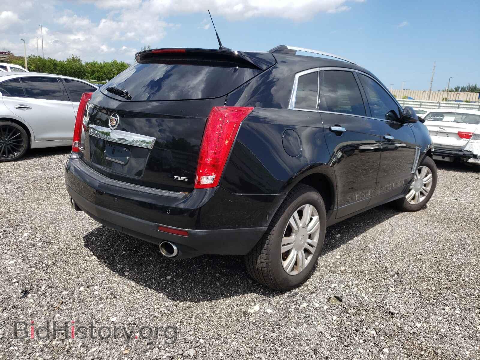 2014 CADILLAC SRX - VIN: 3GYFNBE39ES628367 - Фото 4