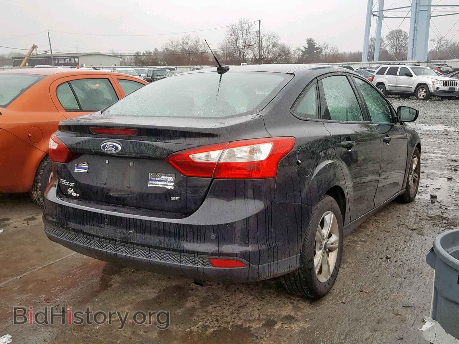 2014 FORD FOCUS - VIN: 1FADP3F21EL377679 - Photo 4