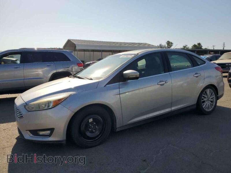 2015 Ford FOCUS Titanium (VIN 1FADP3J29FL269772) — фото 1 из 12, Copart, повреждение: передняя часть