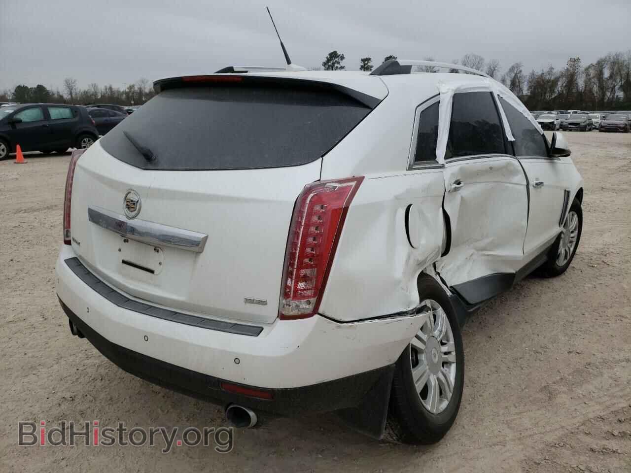 2014 CADILLAC SRX - VIN: 3GYFNBE39ES681277 - Фото 4