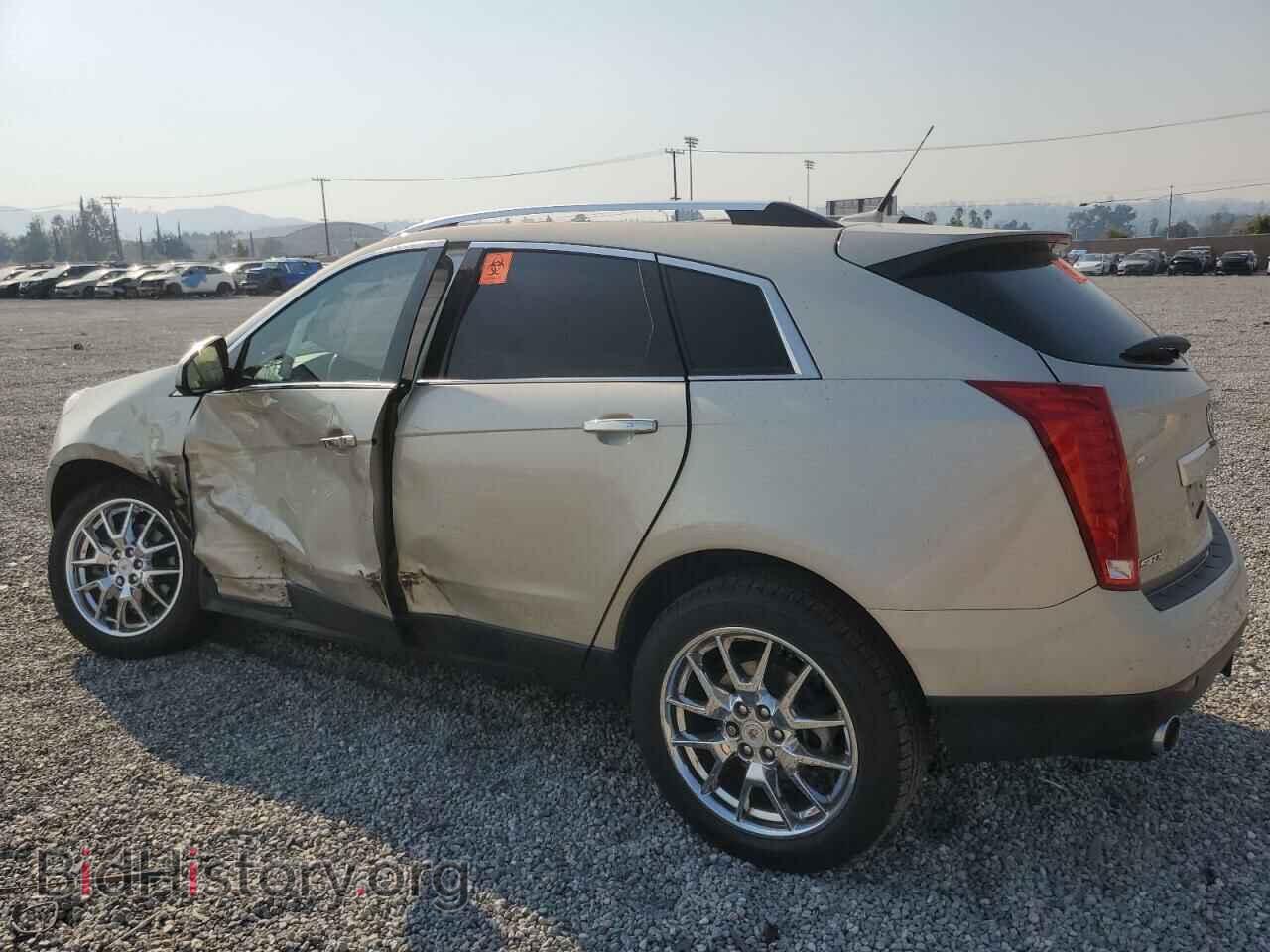 2014 CADILLAC SRX - VIN: 3GYFNDE34ES521870 - Фото 2