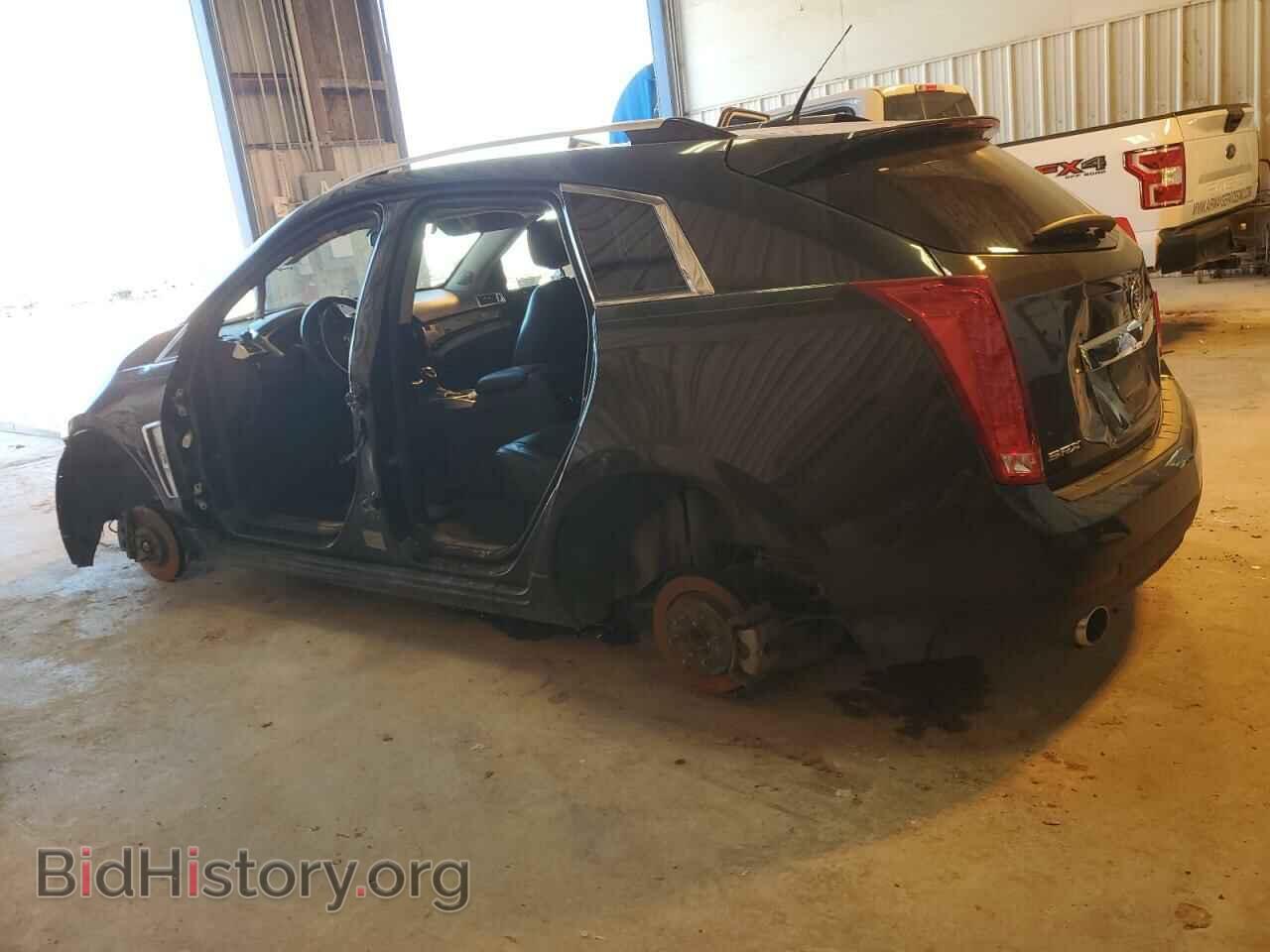 2014 CADILLAC SRX - VIN: 3GYFNCE30ES628439 - Фото 2