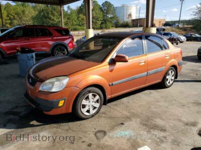 2009 Kia RIO Base, orange — VIN KNADE223296571762, Copart