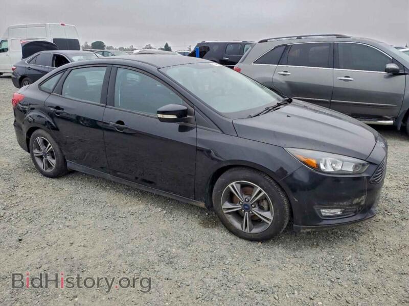 2016 Ford FOCUS (VIN 1FADP3FEXGL311290) — photo 4 of 12
