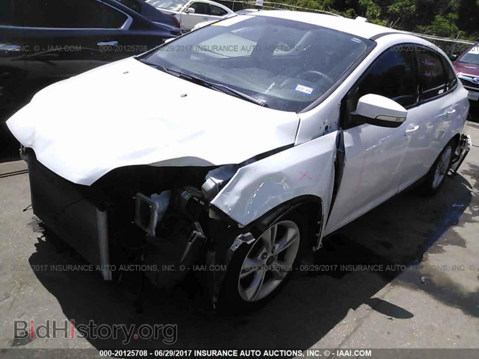 2014 Ford Focus - VIN: 1FADP3F20EL109402 - Фото 2