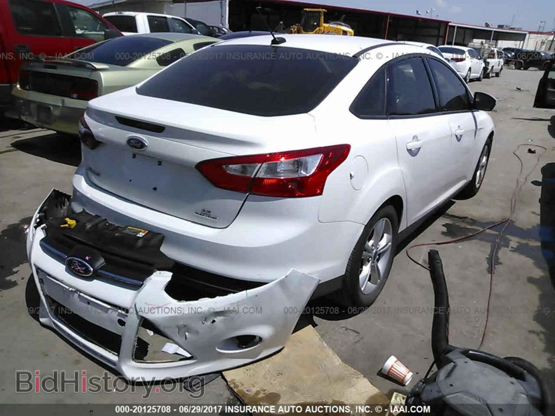2014 Ford Focus - VIN: 1FADP3F20EL109402 - Фото 4