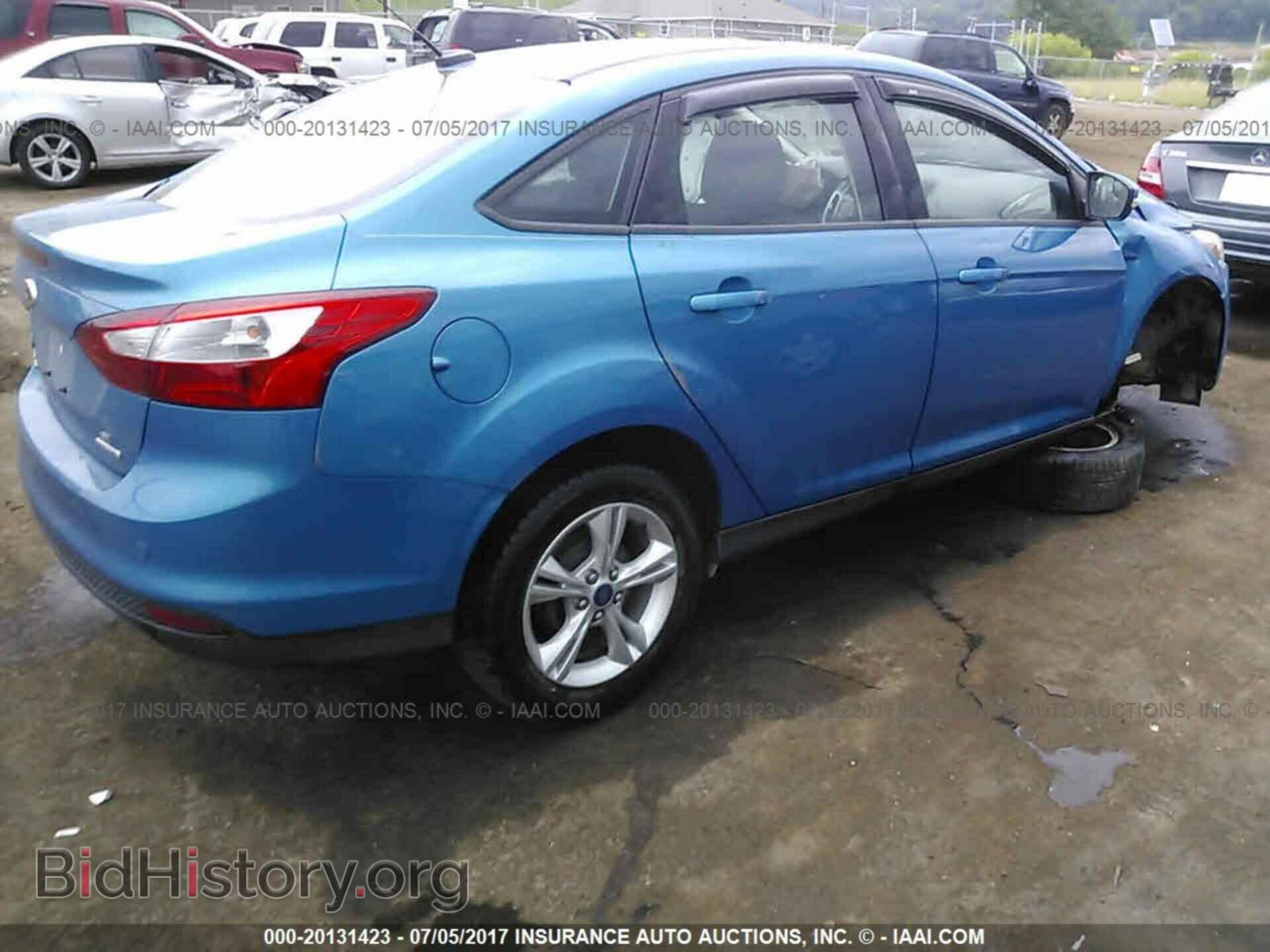 2014 Ford Focus - VIN: 1FADP3F21EL305106 - Photo 4