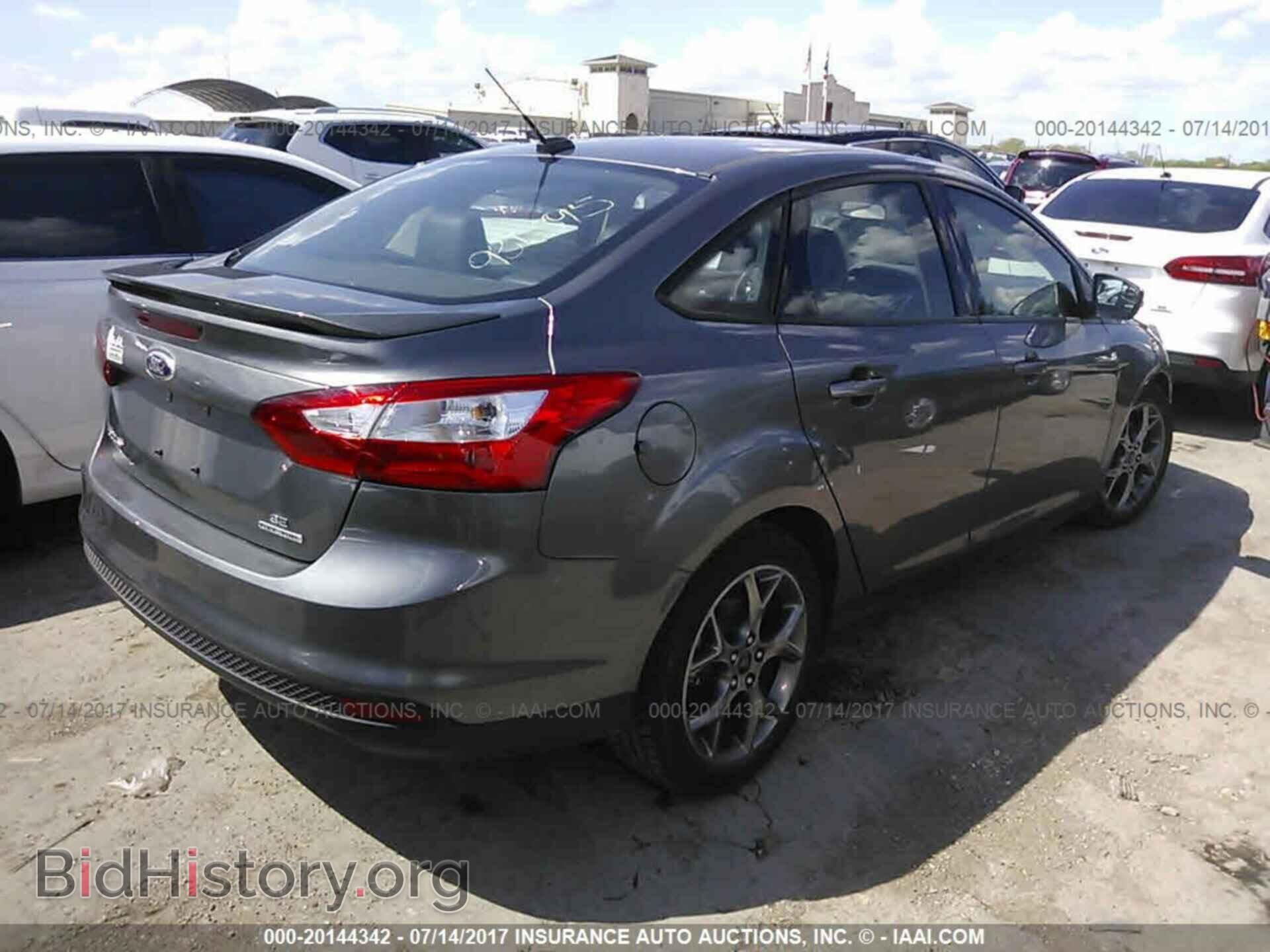 2014 Ford Focus - VIN: 1FADP3F21EL253833 - Photo 4