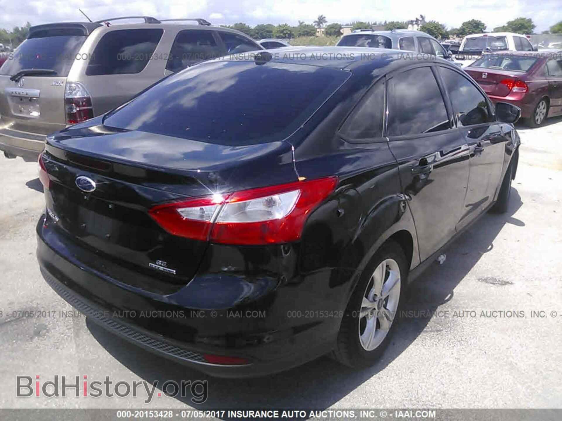 2014 Ford Focus - VIN: 1FADP3F21EL231329 - Фото 4