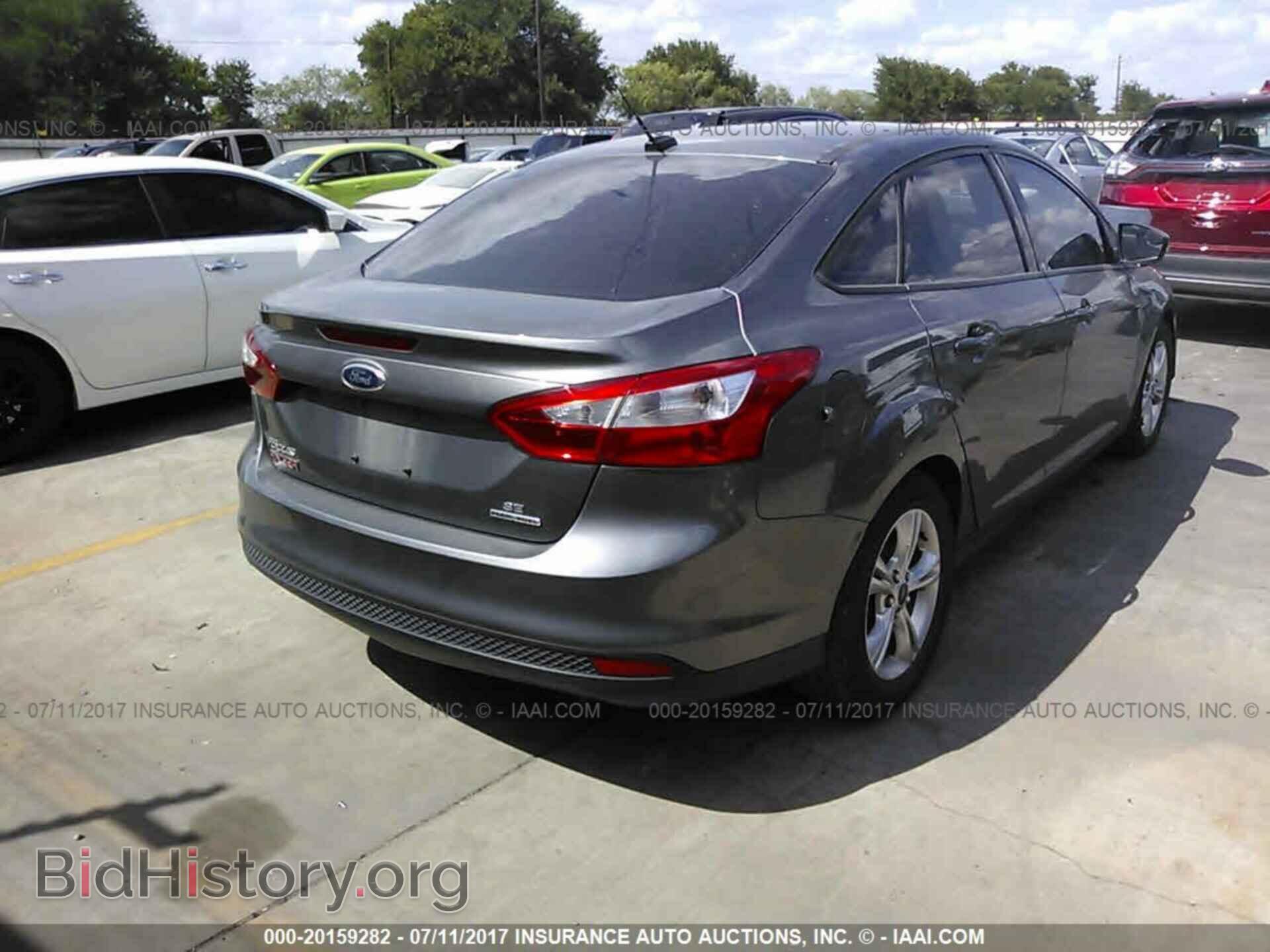 2014 Ford Focus - VIN: 1FADP3F20EL259302 - Фото 4