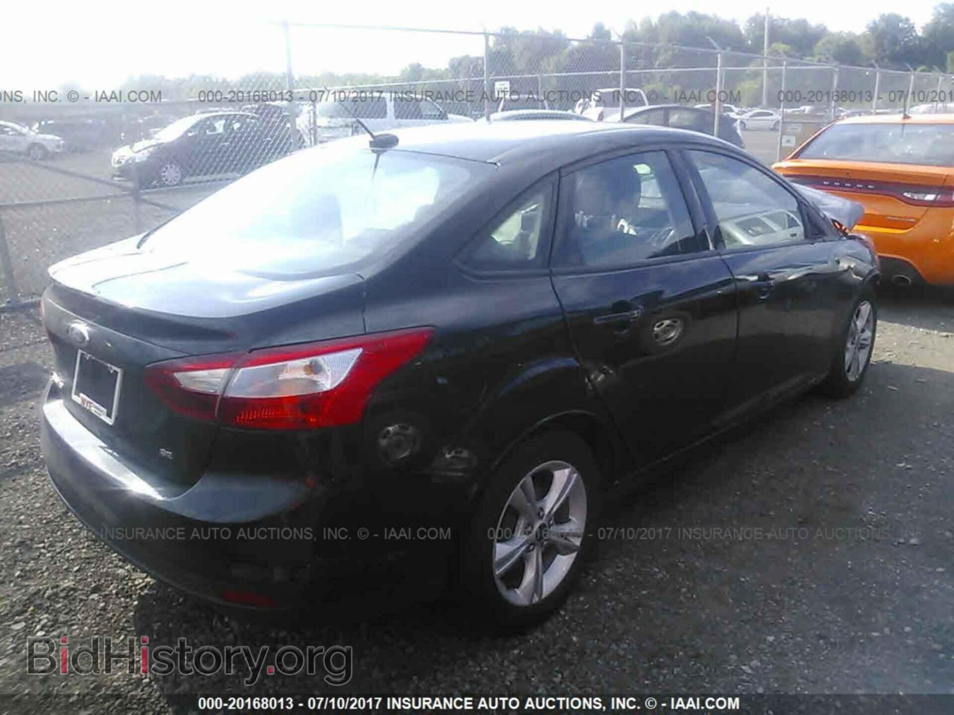 2014 Ford Focus - VIN: 1FADP3F26EL424818 - Photo 4