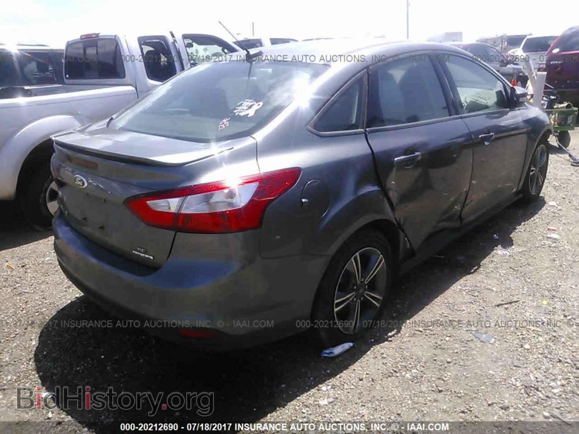 2014 Ford Focus - VIN: 1FADP3F21EL276061 - Фото 4