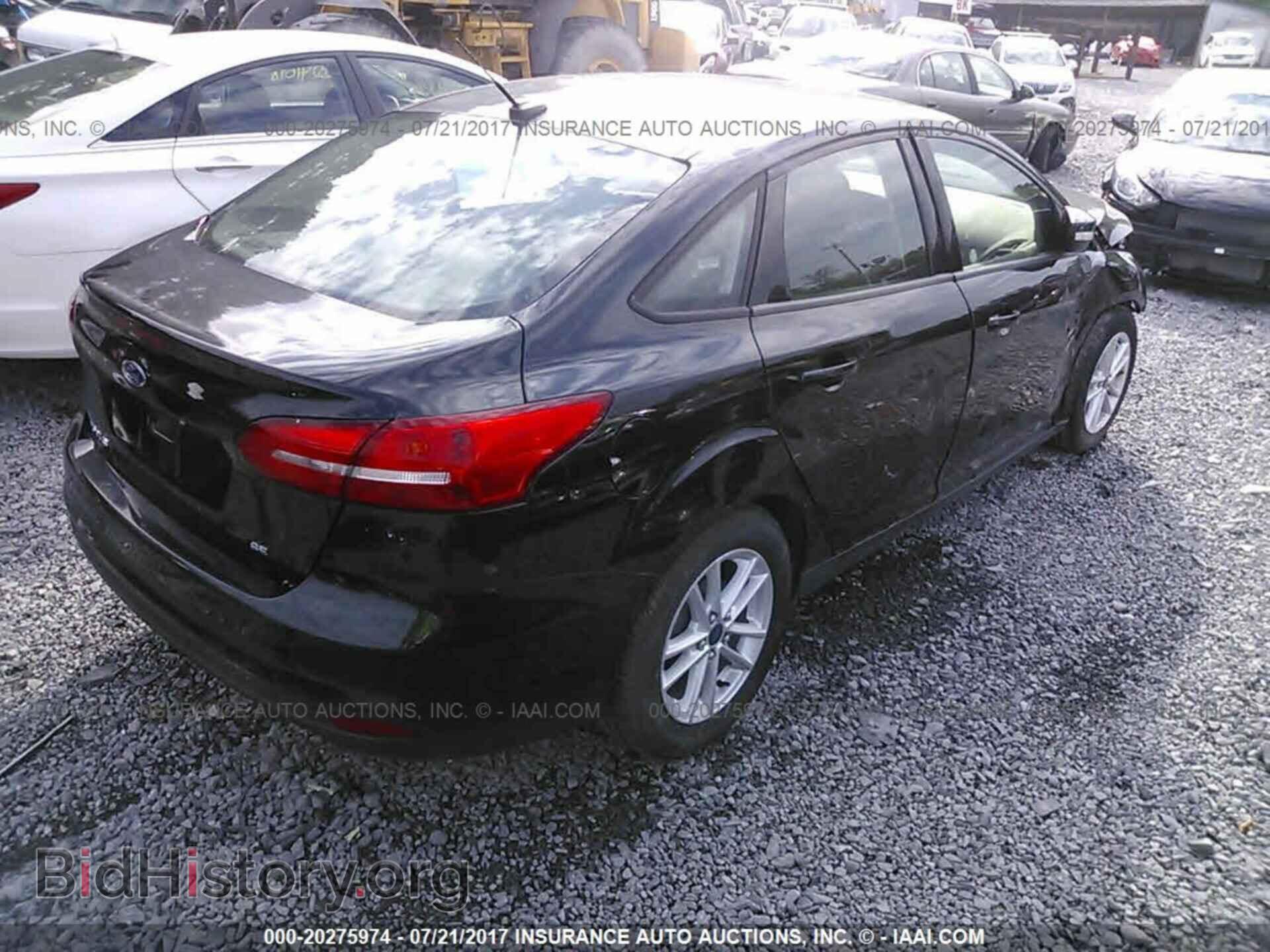 2015 Ford Focus - VIN: 1FADP3F21FL296490 - Photo 4