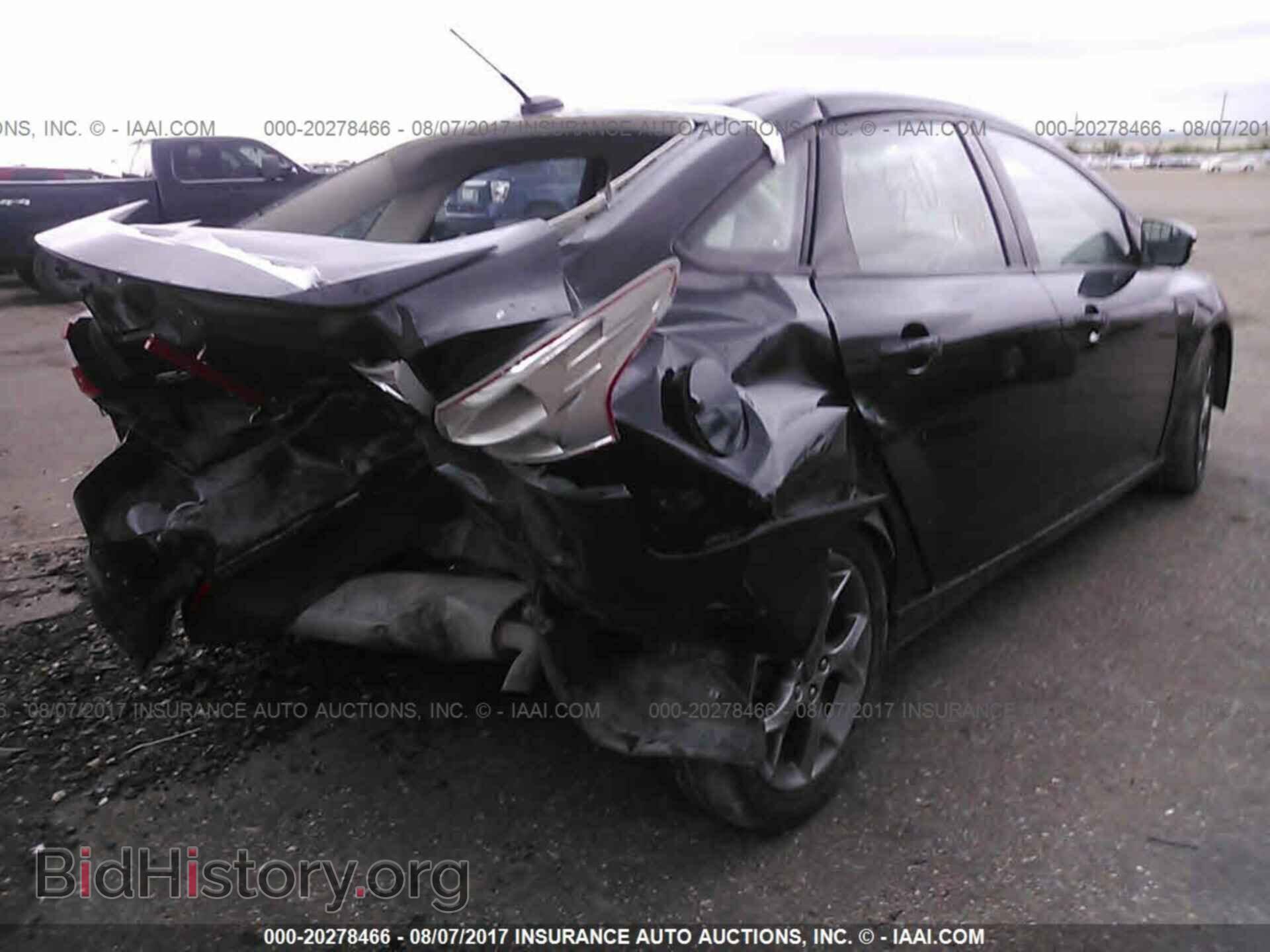 2014 Ford Focus - VIN: 1FADP3F22EL291877 - Фото 4