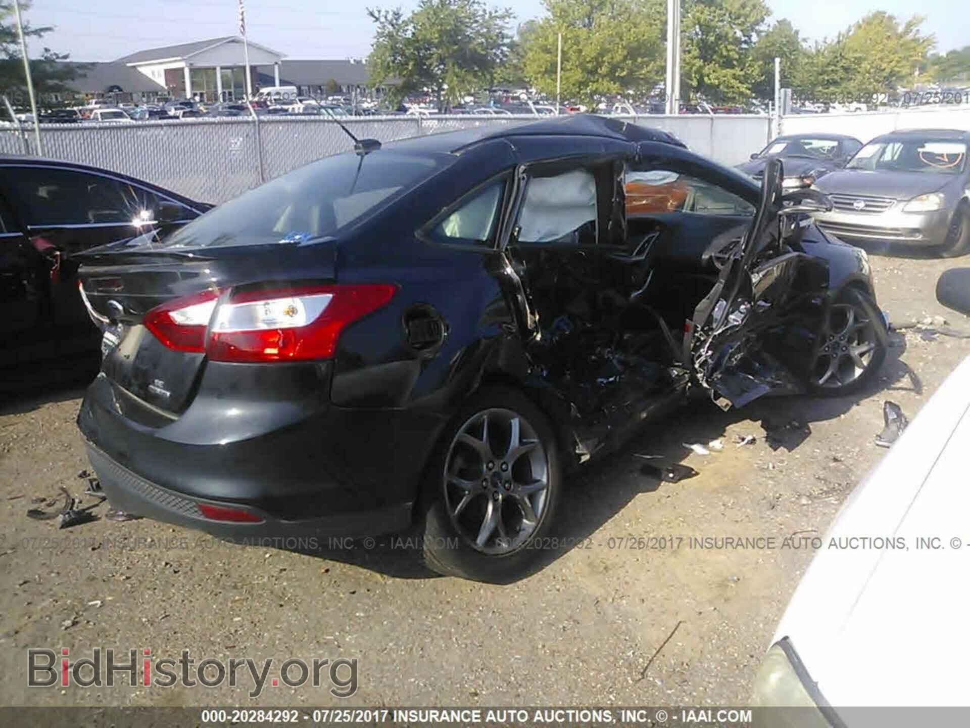 2014 Ford Focus - VIN: 1FADP3F21EL338932 - Photo 4