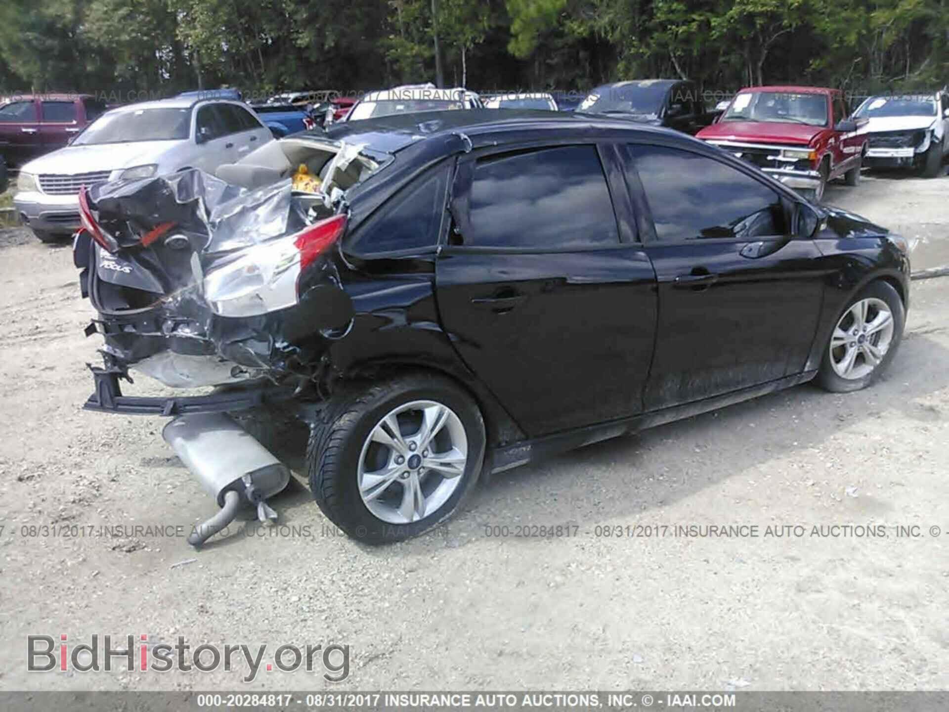 2014 Ford Focus - VIN: 1FADP3F28EL309539 - Photo 4