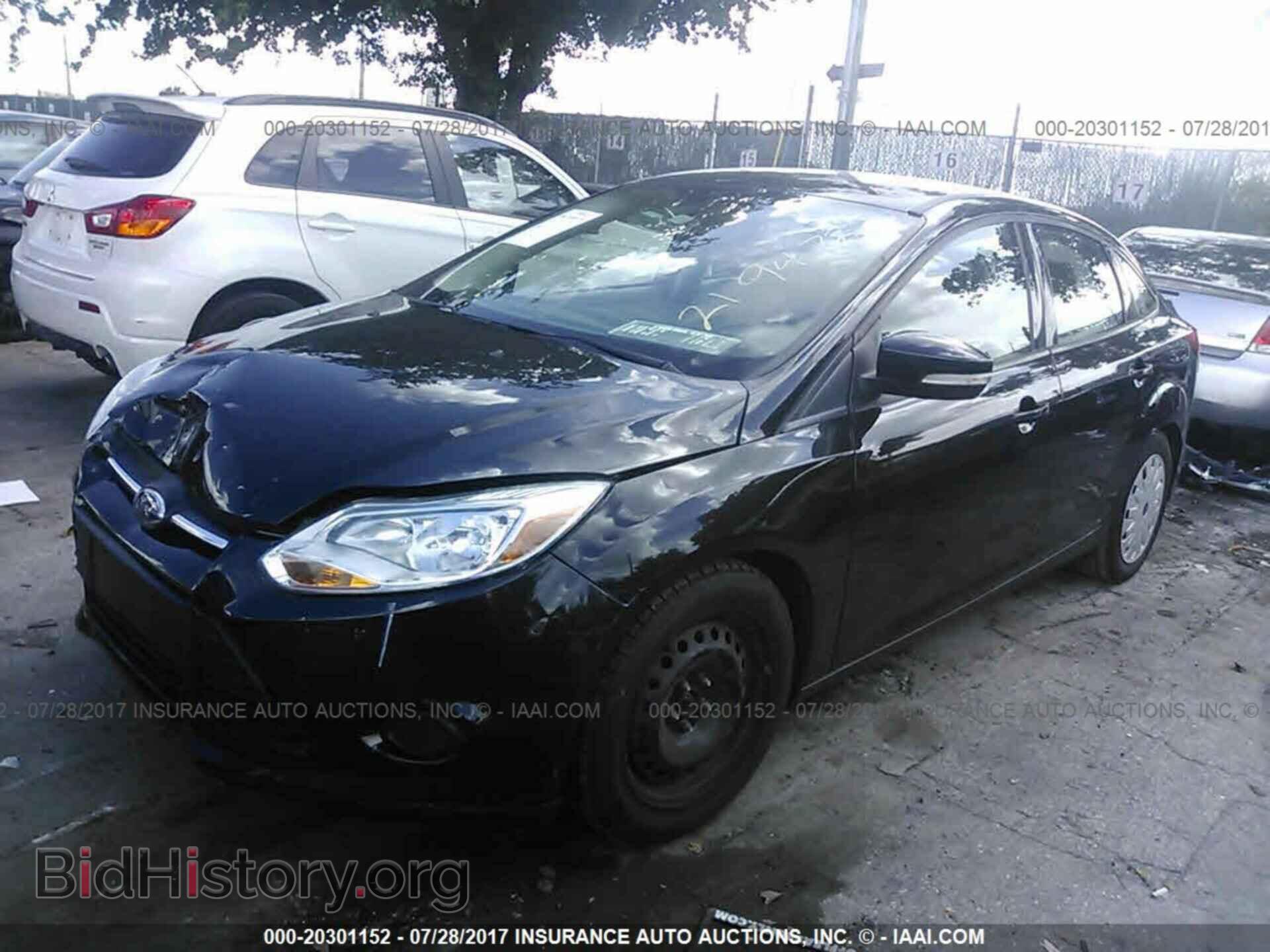 2014 Ford Focus - VIN: 1FADP3F21EL219472 - Photo 2