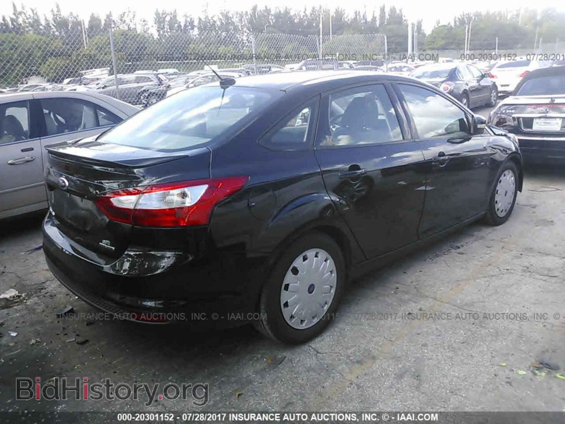 2014 Ford Focus - VIN: 1FADP3F21EL219472 - Photo 4