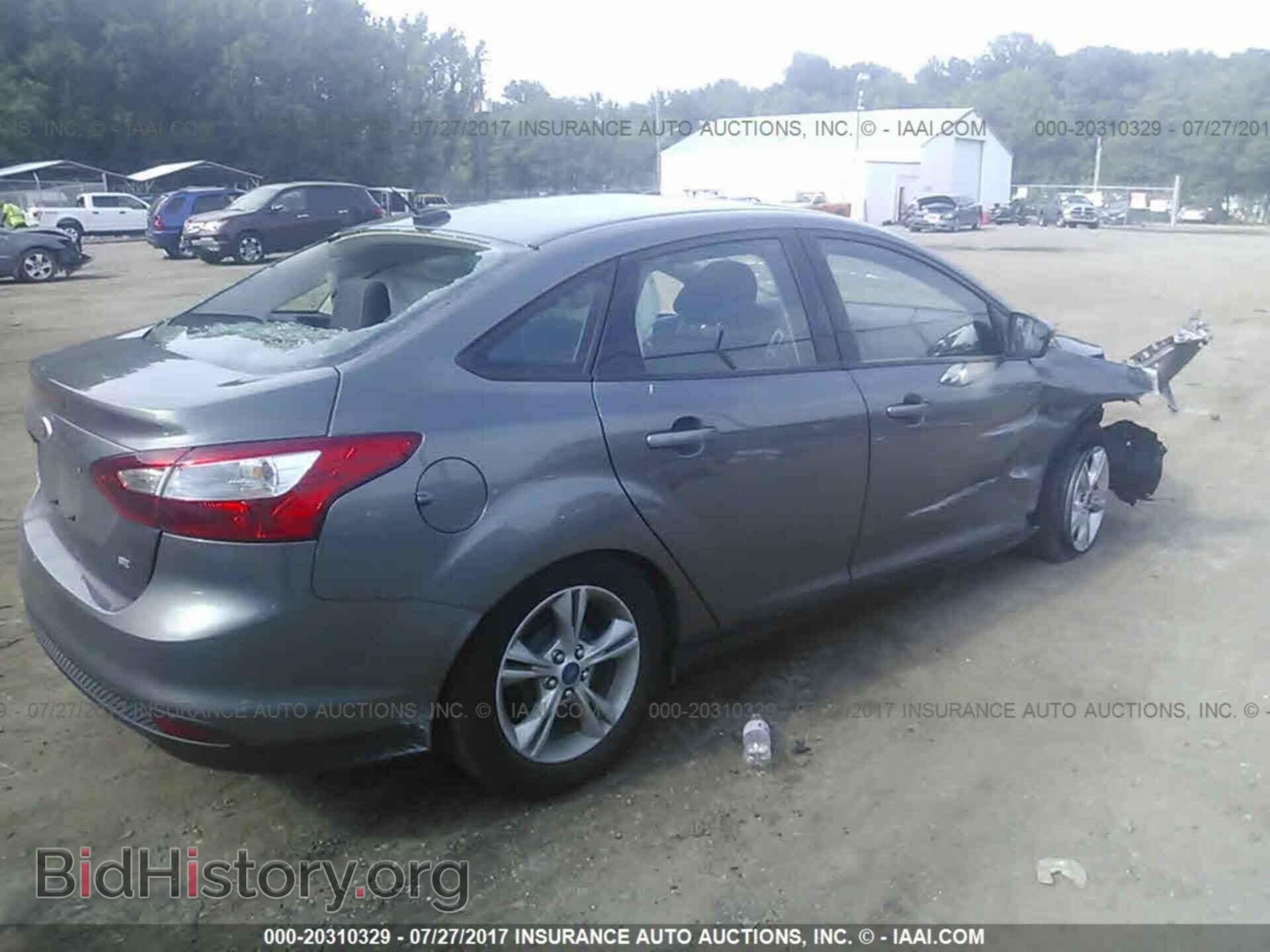 2014 Ford Focus - VIN: 1FADP3F20EL180759 - Фото 4