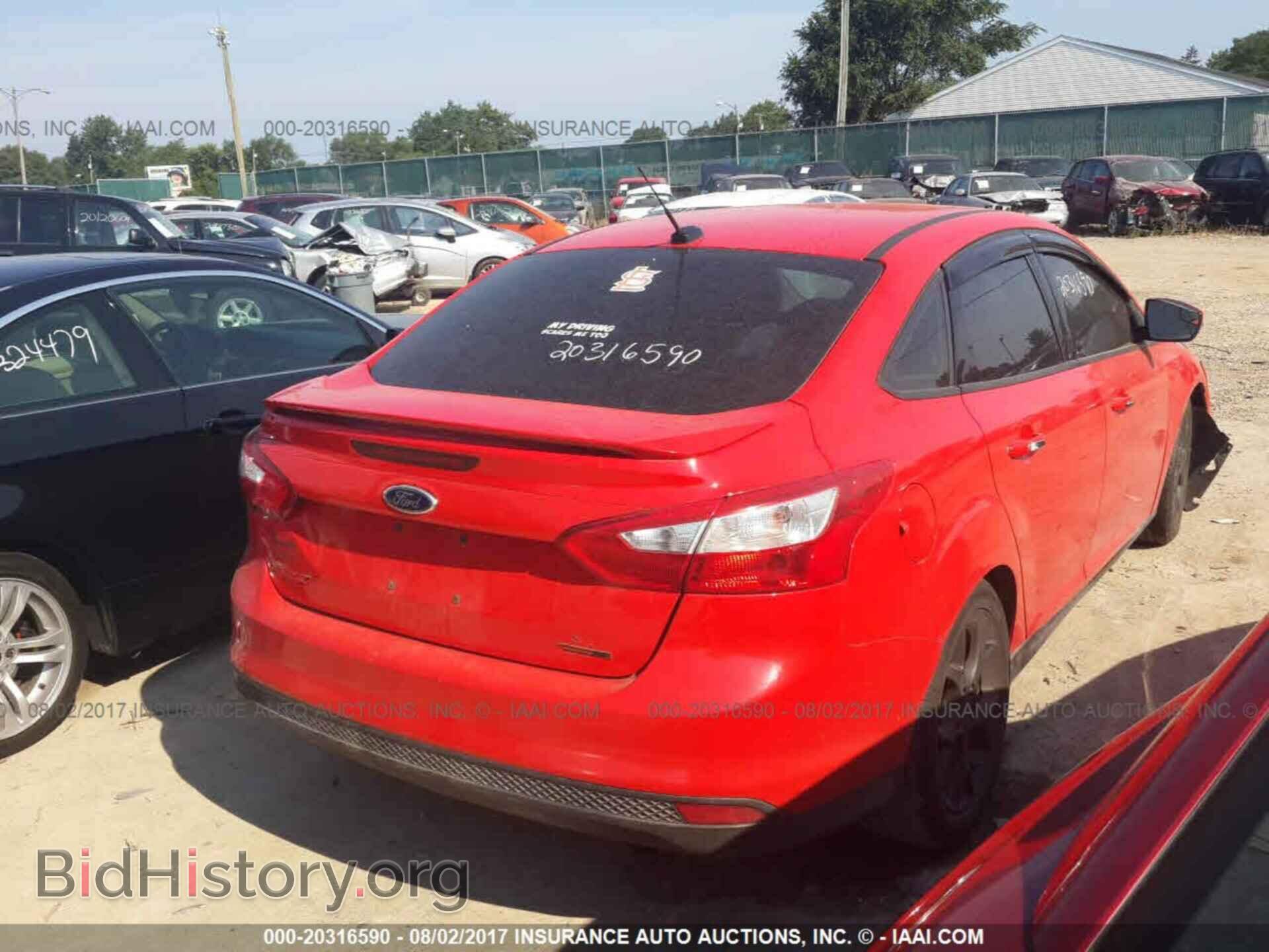 2014 Ford Focus - VIN: 1FADP3F21EL214109 - Фото 4