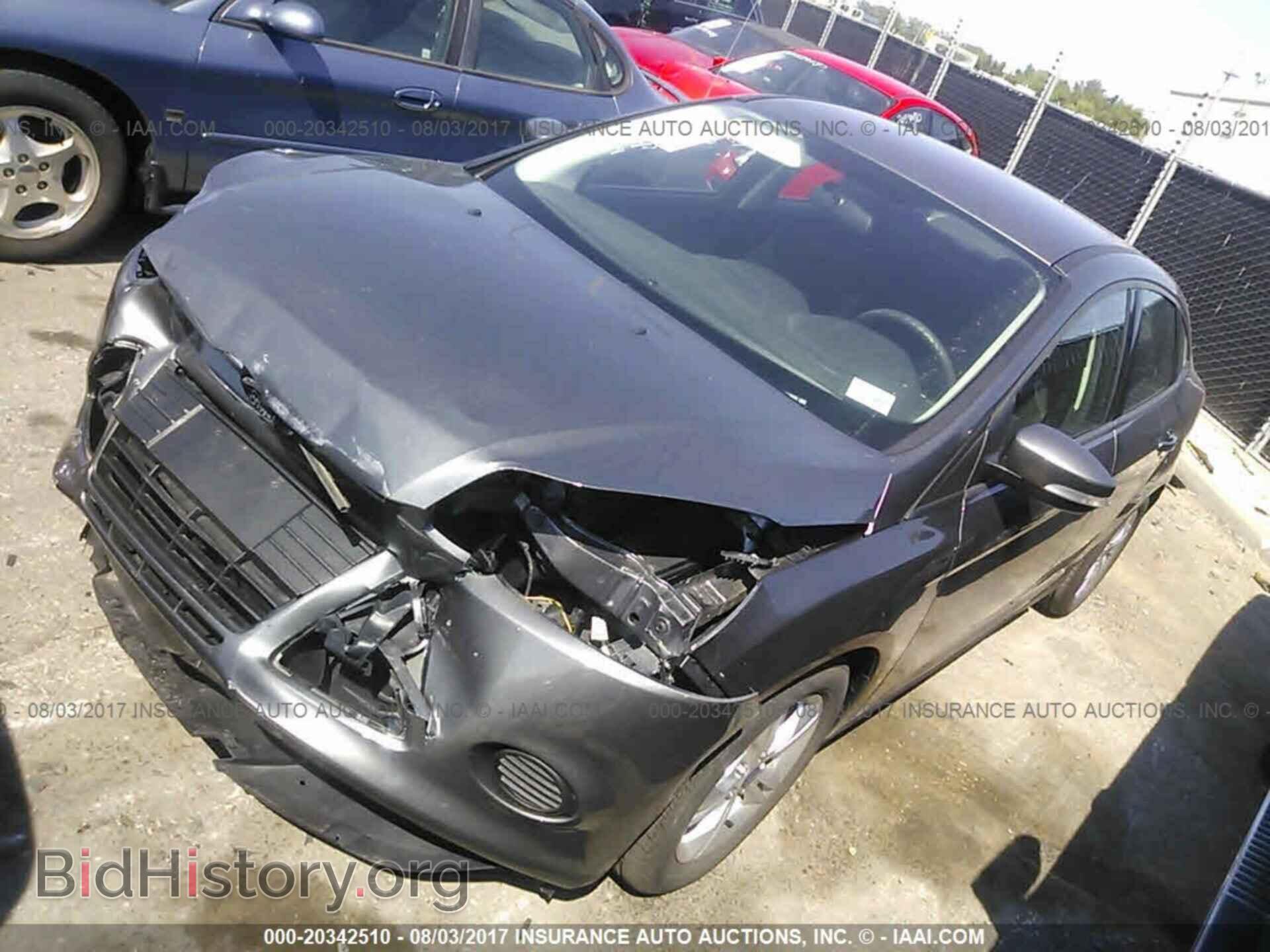 2014 Ford Focus - VIN: 1FADP3F21EL138049 - Photo 2