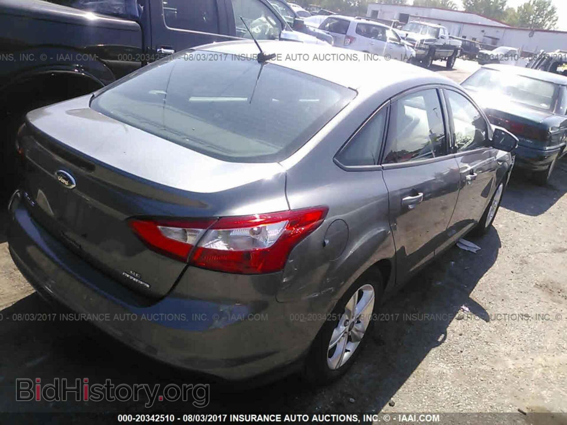 2014 Ford Focus - VIN: 1FADP3F21EL138049 - Photo 4