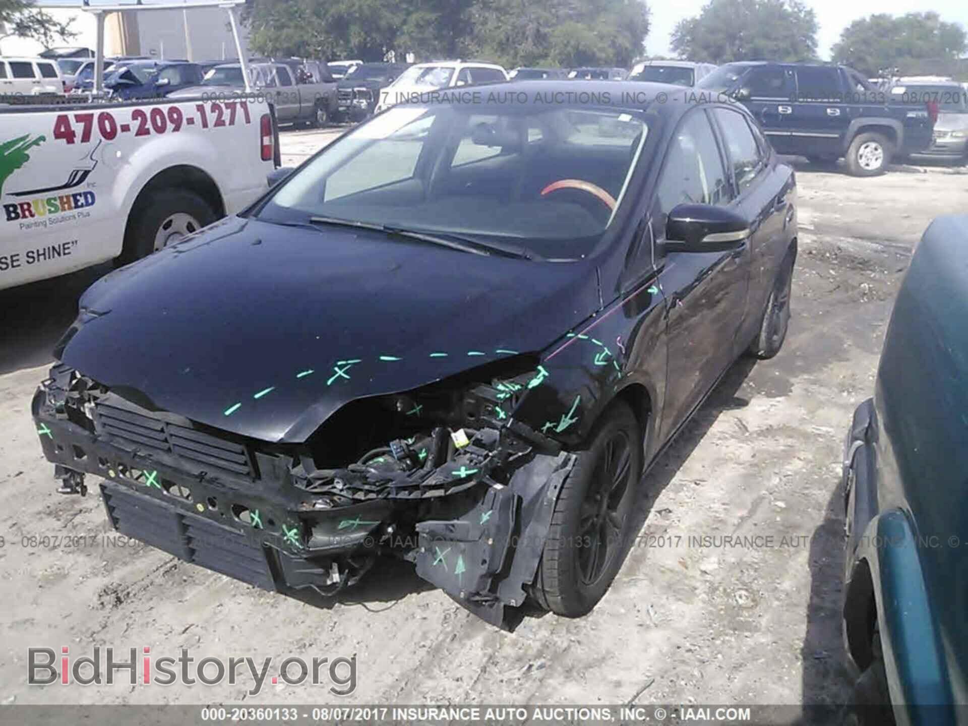 2014 Ford Focus - VIN: 1FADP3F21EL102300 - Фото 2
