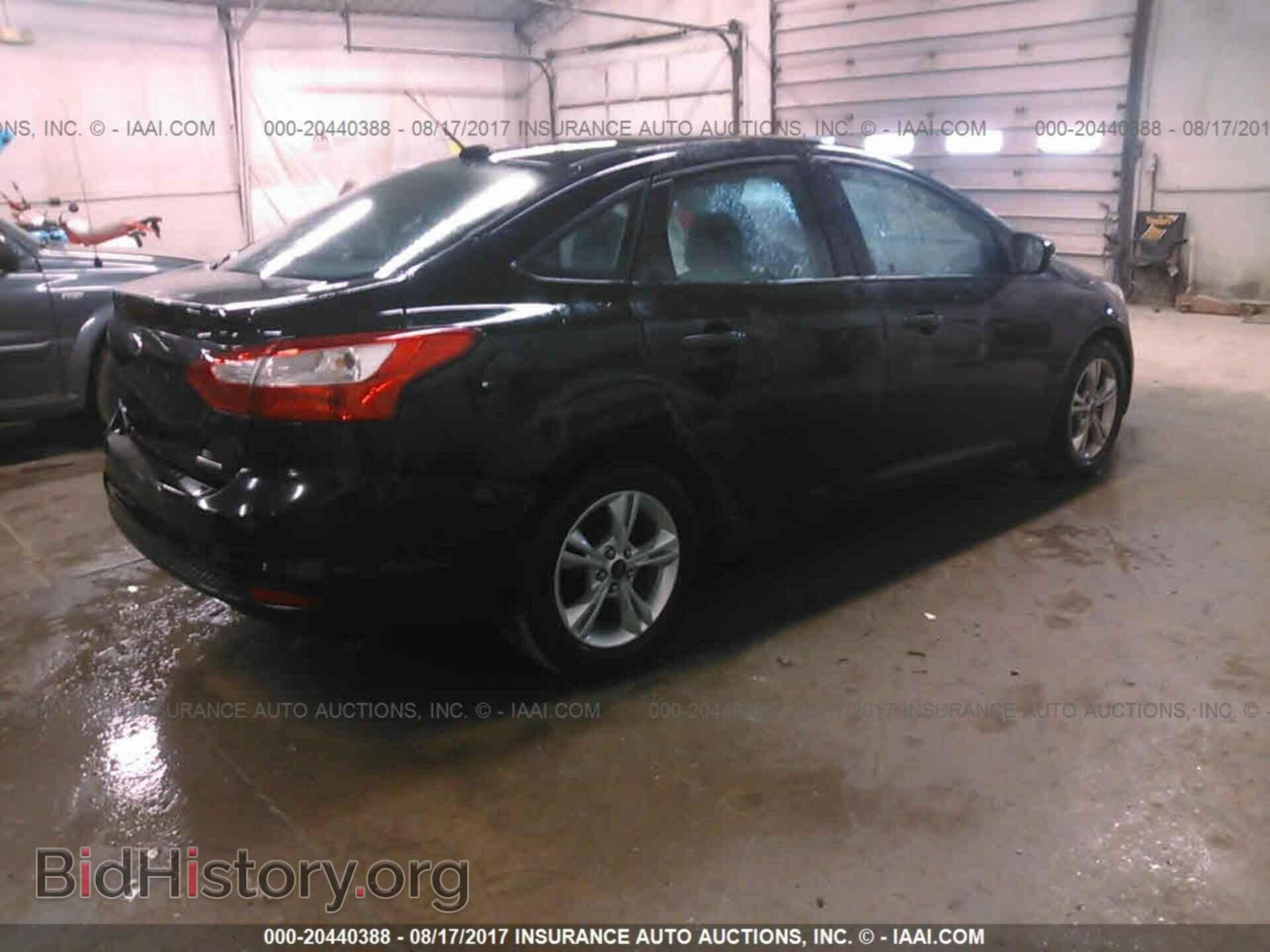 2014 Ford Focus - VIN: 1FADP3F21EL320317 - Photo 4