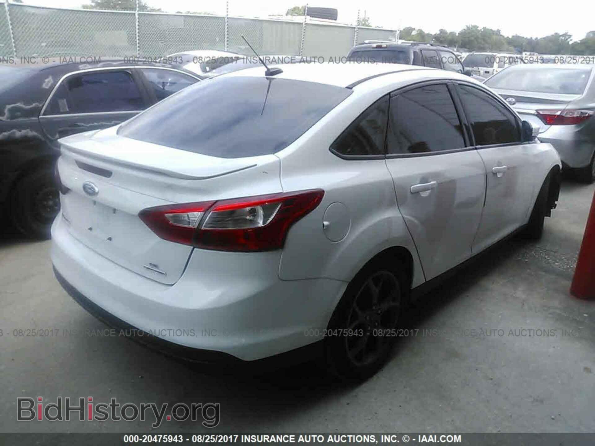 2014 Ford Focus - VIN: 1FADP3F24EL337547 - Photo 4