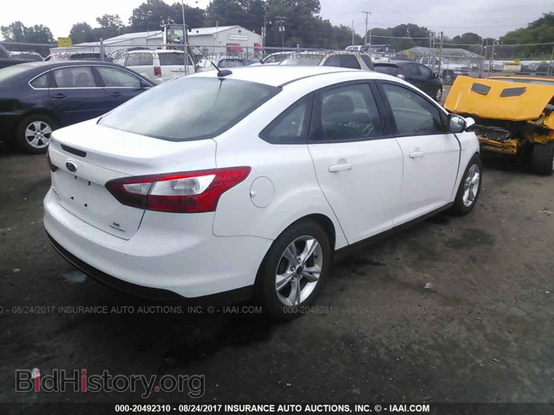 2014 Ford Focus - VIN: 1FADP3F20EL261146 - Фото 4