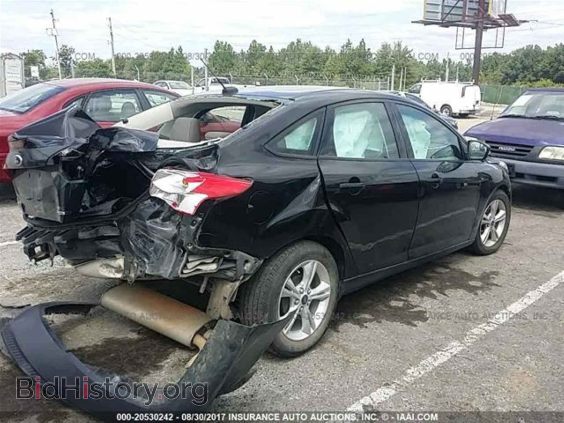 2014 Ford Focus - VIN: 1FADP3F20EL304593 - Фото 4