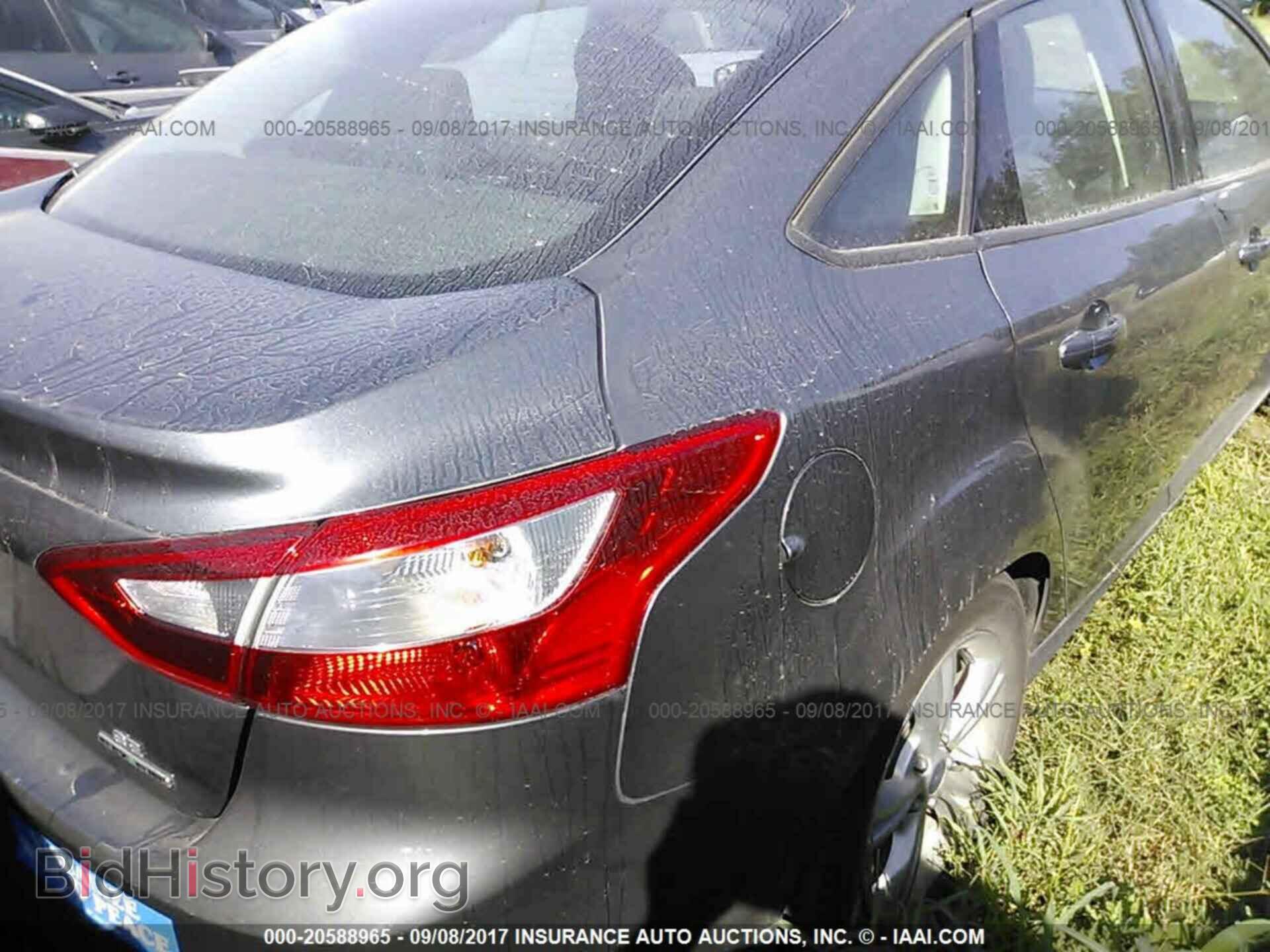 2014 Ford Focus - VIN: 1FADP3F20EL175268 - Фото 4