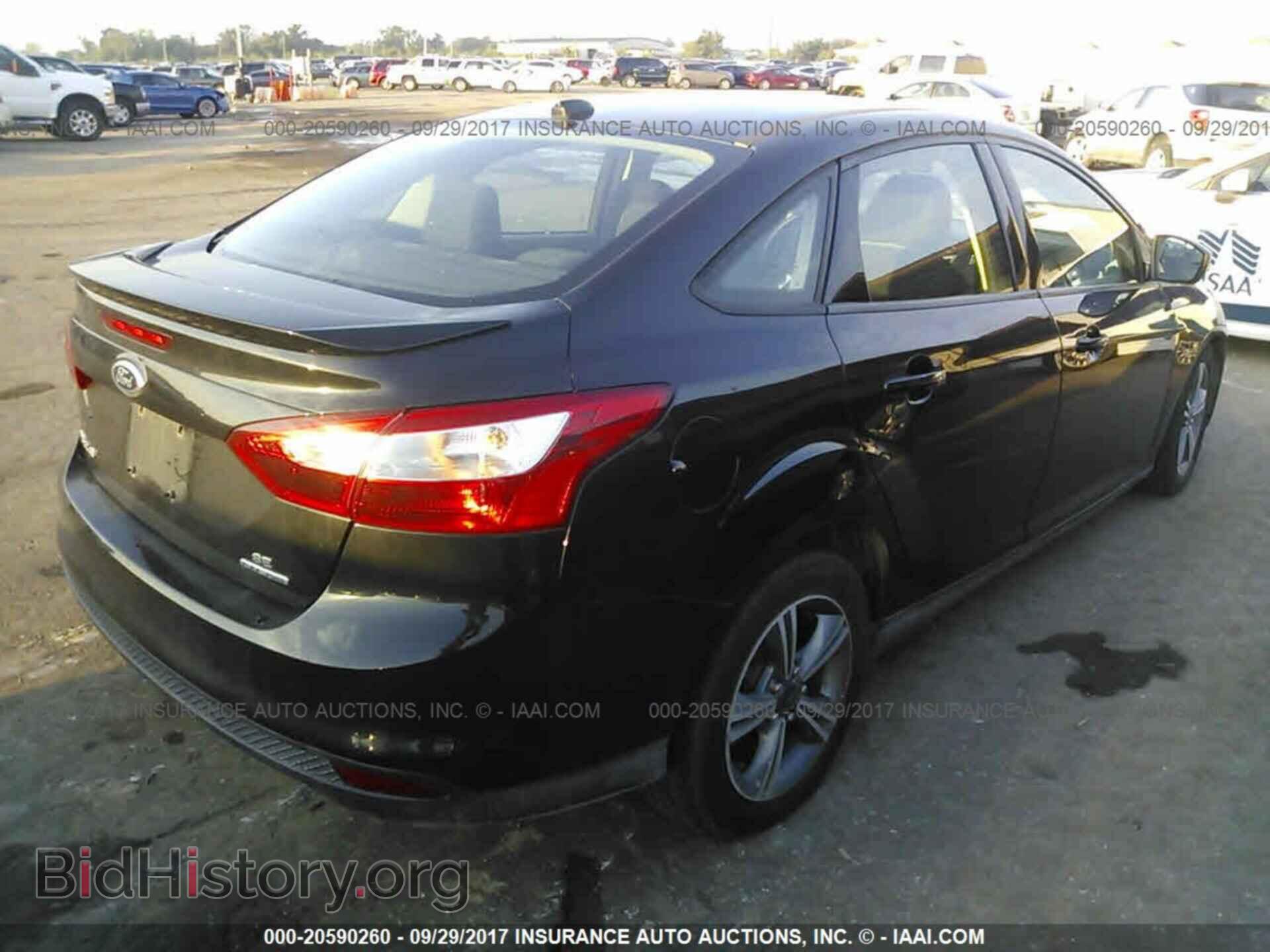 2014 Ford Focus - VIN: 1FADP3F29EL412694 - Photo 4