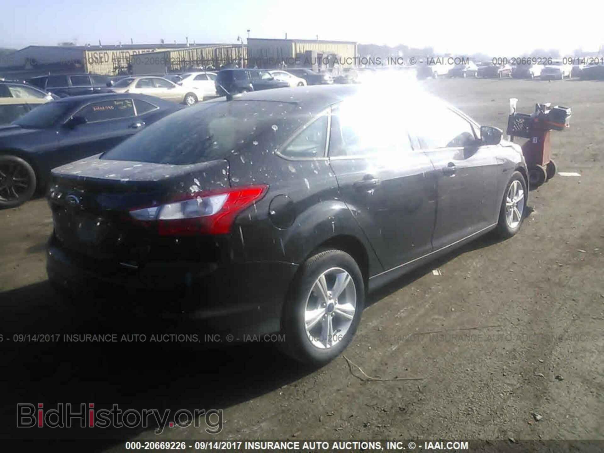 2014 Ford Focus - VIN: 1FADP3F28EL194814 - Фото 4
