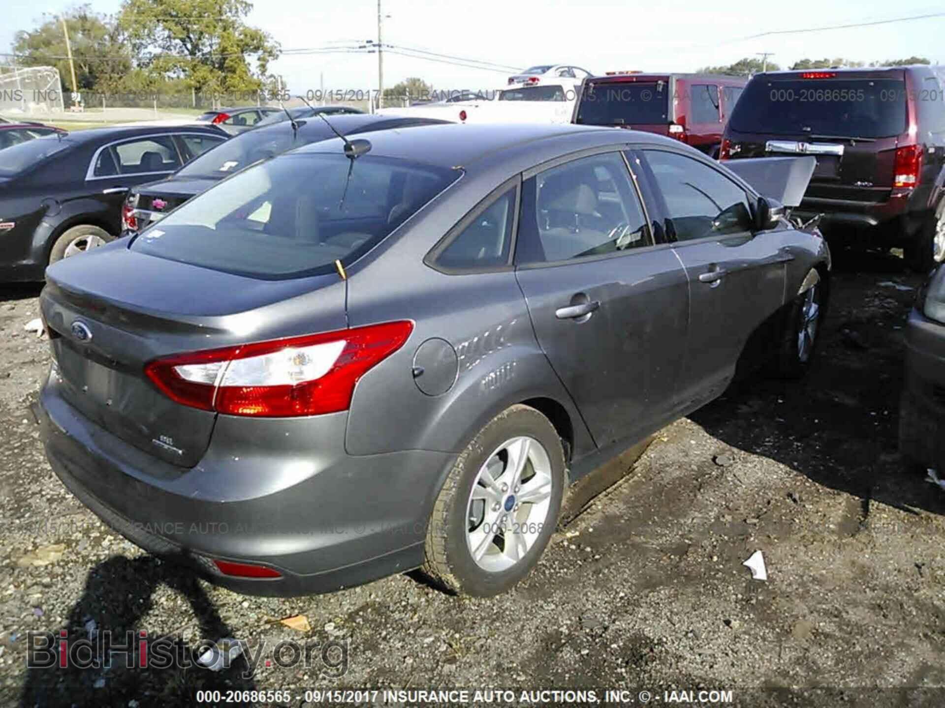 2014 Ford Focus - VIN: 1FADP3F24EL216114 - Фото 4