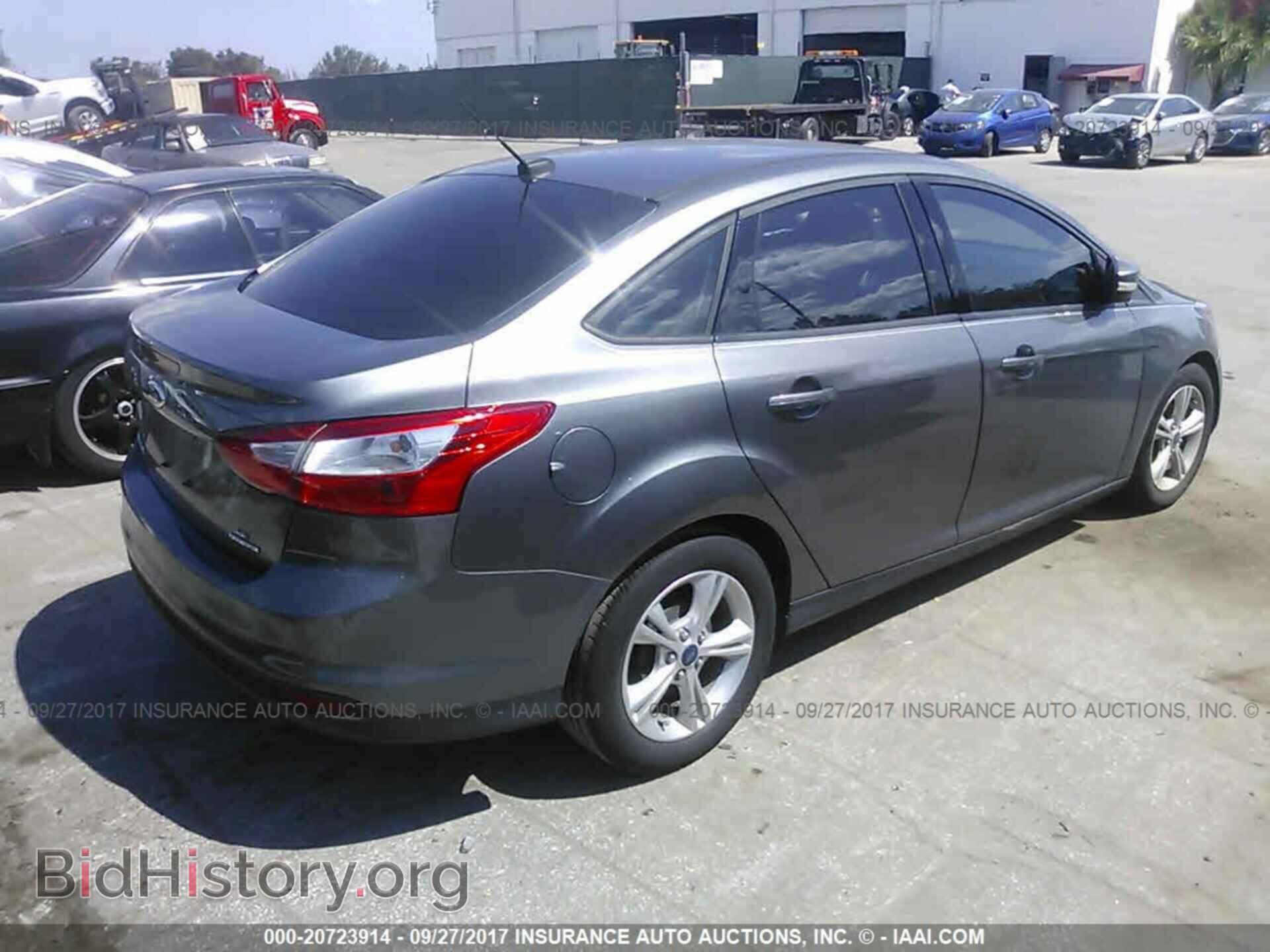 2014 Ford Focus - VIN: 1FADP3F22EL387573 - Photo 4