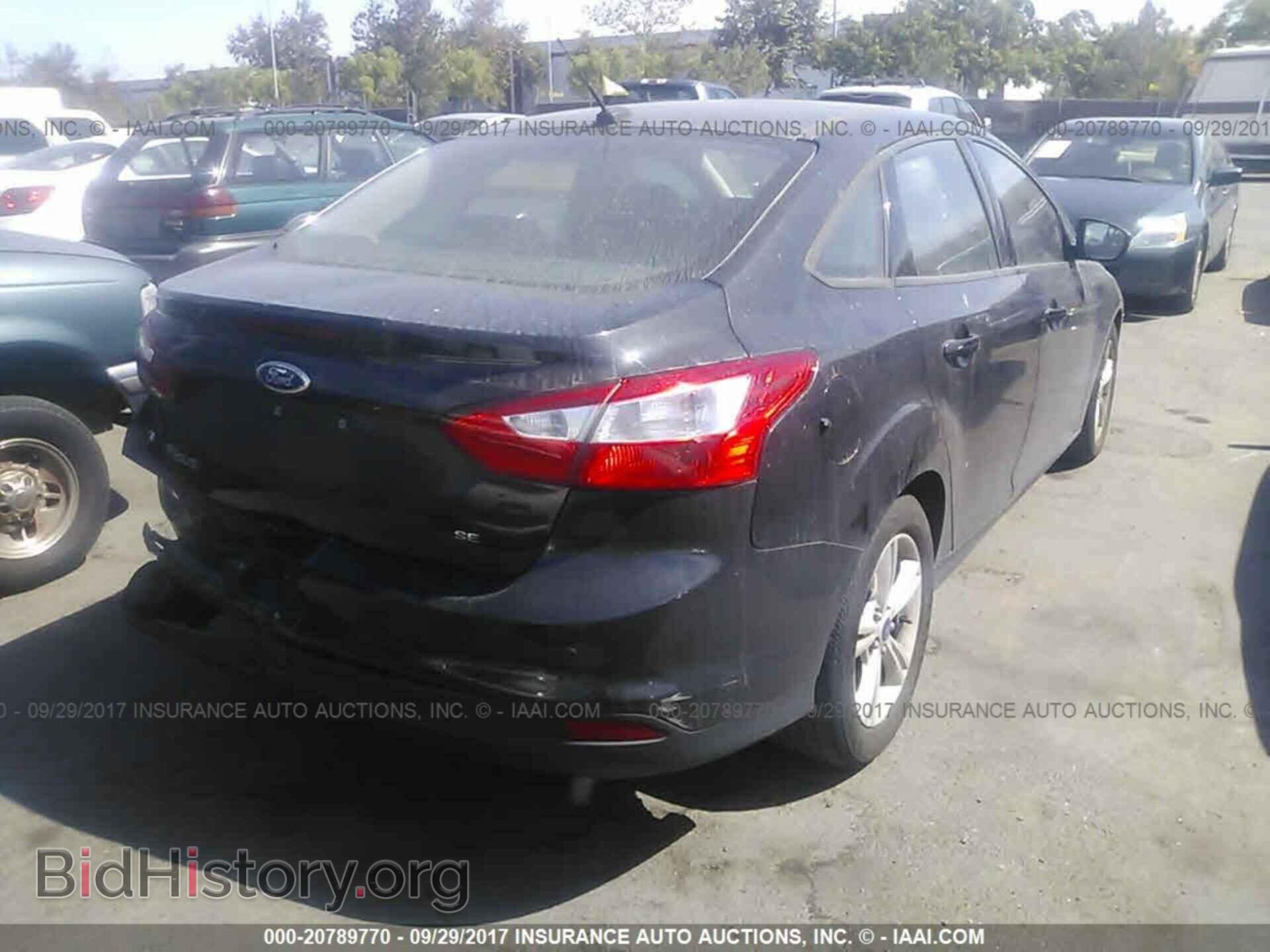 2014 Ford Focus - VIN: 1FADP3F28EL230209 - Photo 4