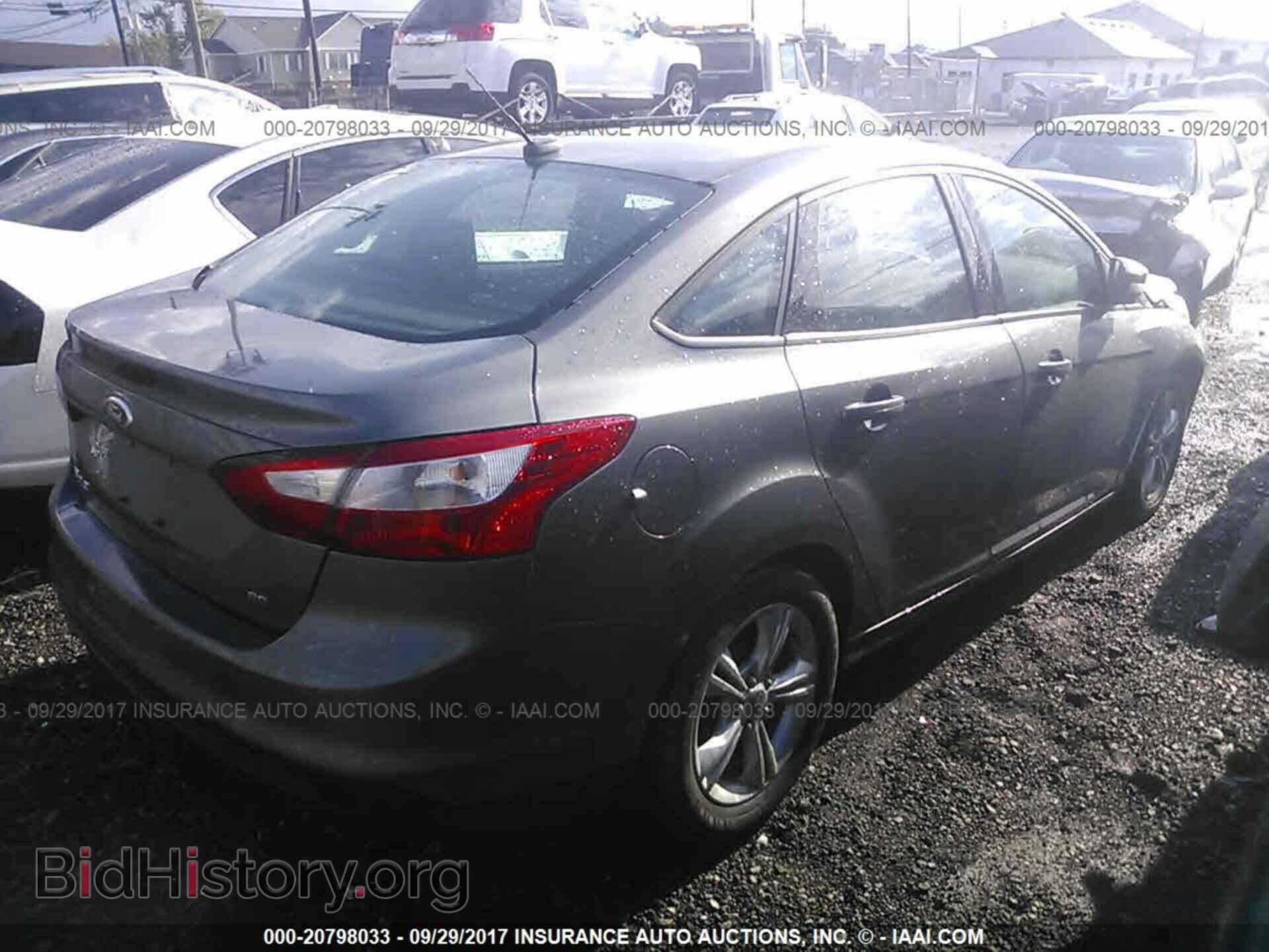 2014 Ford Focus - VIN: 1FADP3F24EL305102 - Фото 4