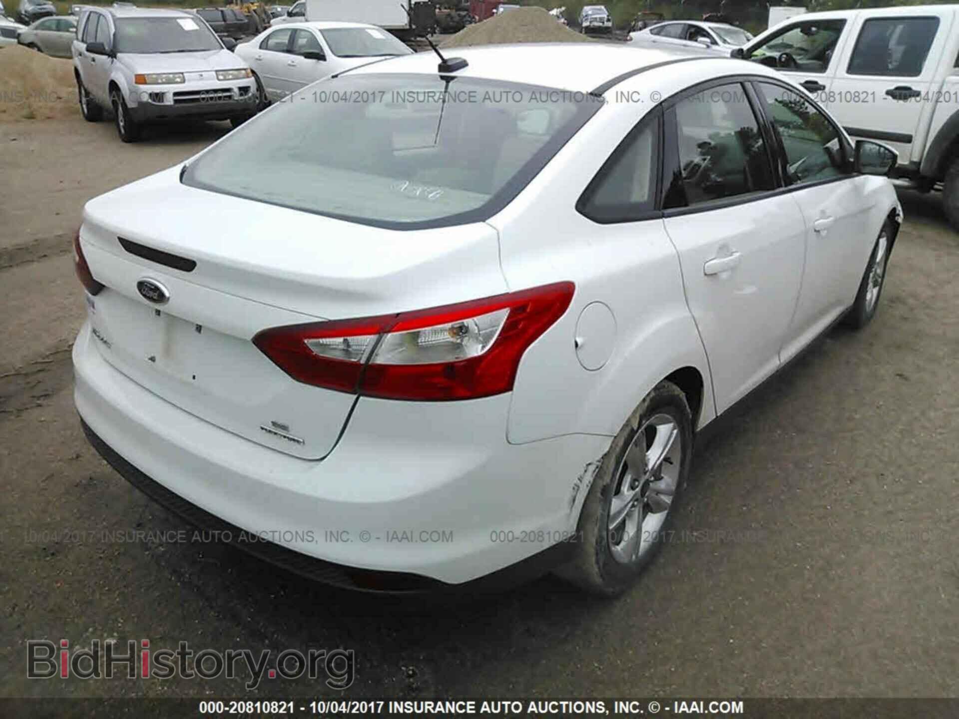 2014 Ford Focus - VIN: 1FADP3F21EL162979 - Photo 4