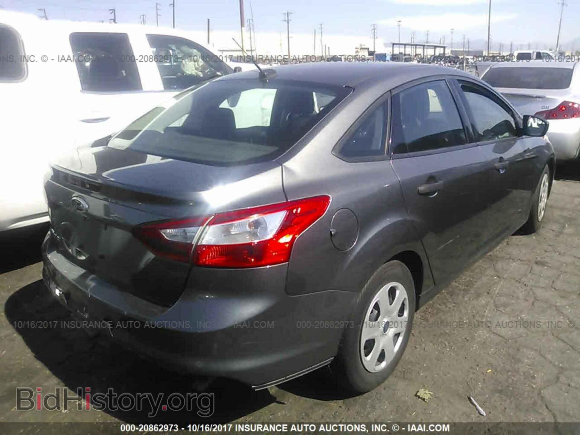 2014 Ford Focus - VIN: 1FADP3E25EL311847 - Photo 4