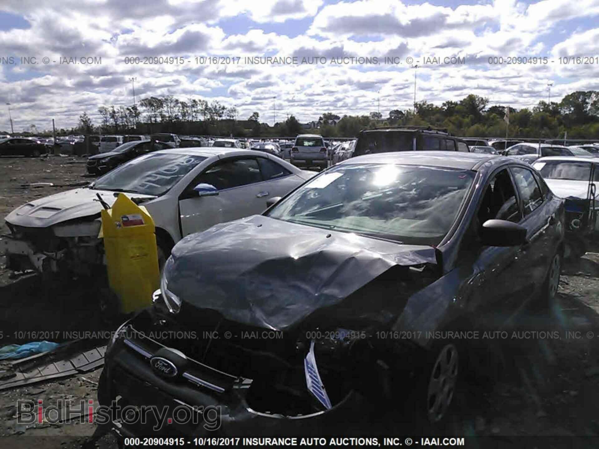 2014 Ford Focus - VIN: 1FADP3E24EL418582 - Фото 2