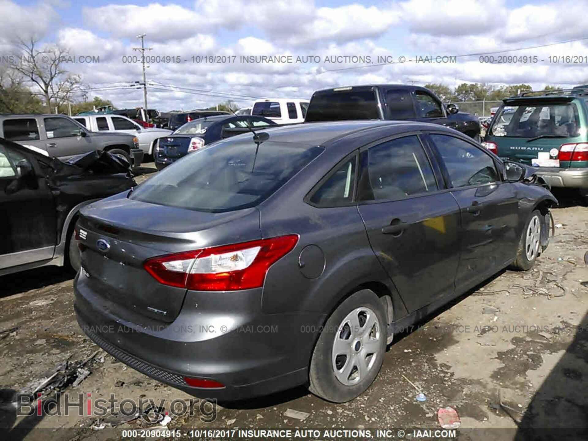 2014 Ford Focus - VIN: 1FADP3E24EL418582 - Фото 4